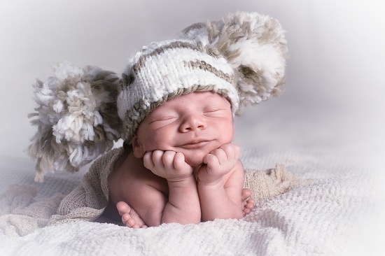 newborn with hat