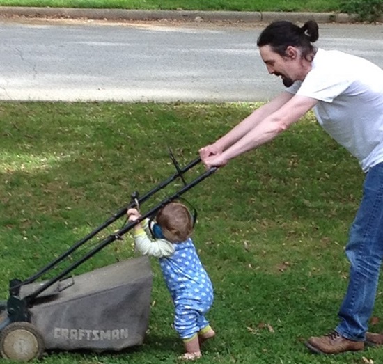 child mowing lawn