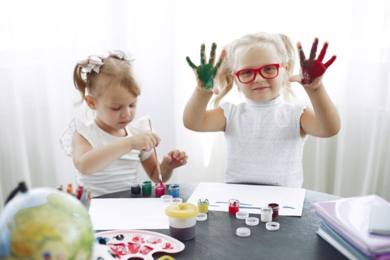 girls finger painting