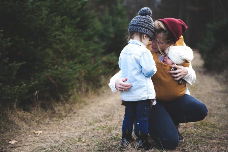 child comforted by mom