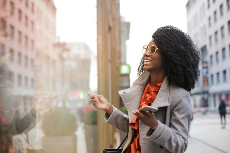 woman shopping and laughing in the street